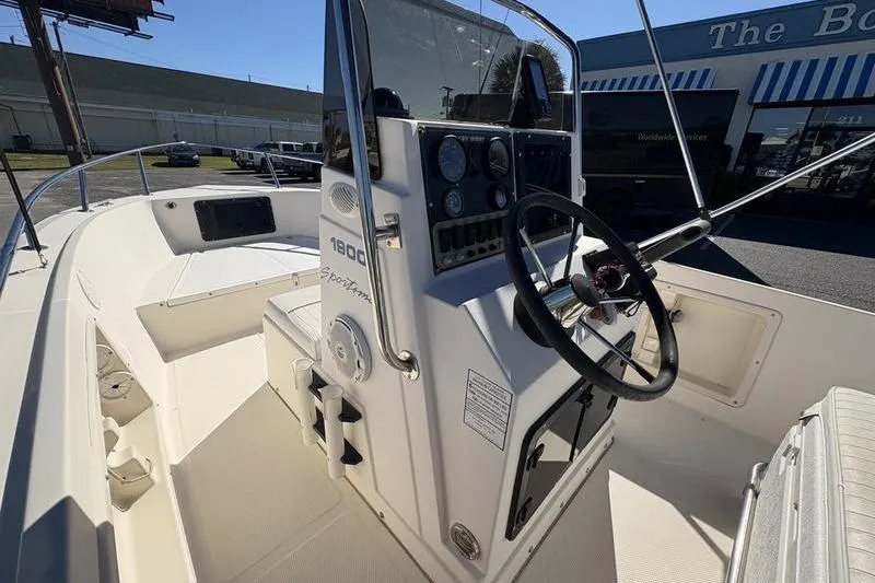Slide: The Image of 2002 Key West 1900 Center Console boat interior with steering wheel and dashboard. - 19