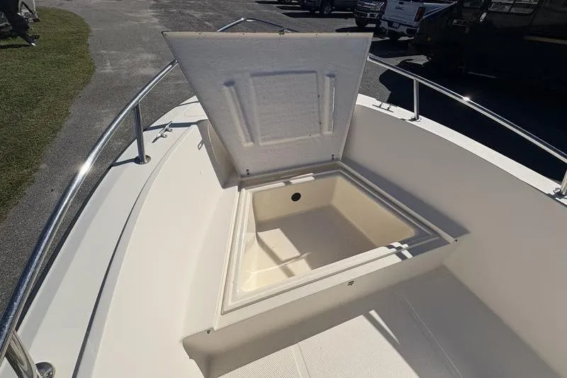Slide: The Image of Open storage compartment on a 2002 Key West 1900 Center Console boat. - 22