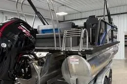 The Image of 2025 Qwest Lanai E-Class Tripletoon pontoon boat in a showroom. - 0