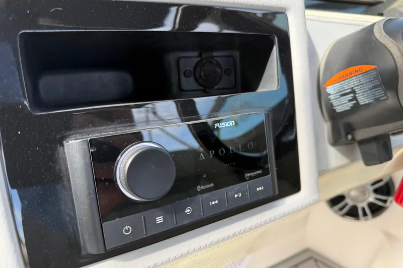 Slide: The Image of Fusion Apollo audio system on 2021 Regal 26 OBX boat dashboard. - 10