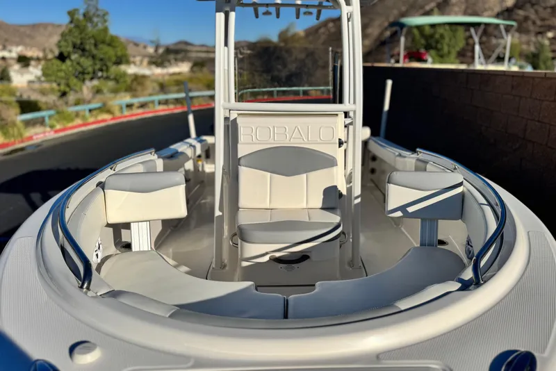 Slide: The Image of 2022 Robalo R222 Center Console boat with spacious seating and sleek design. - 11
