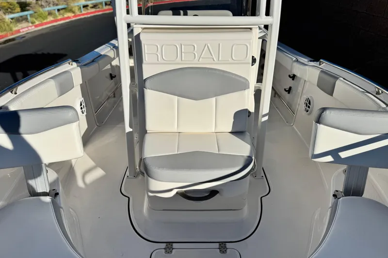 Slide: The Image of 2022 Robalo R222 Center Console boat interior with white and gray seating. - 14