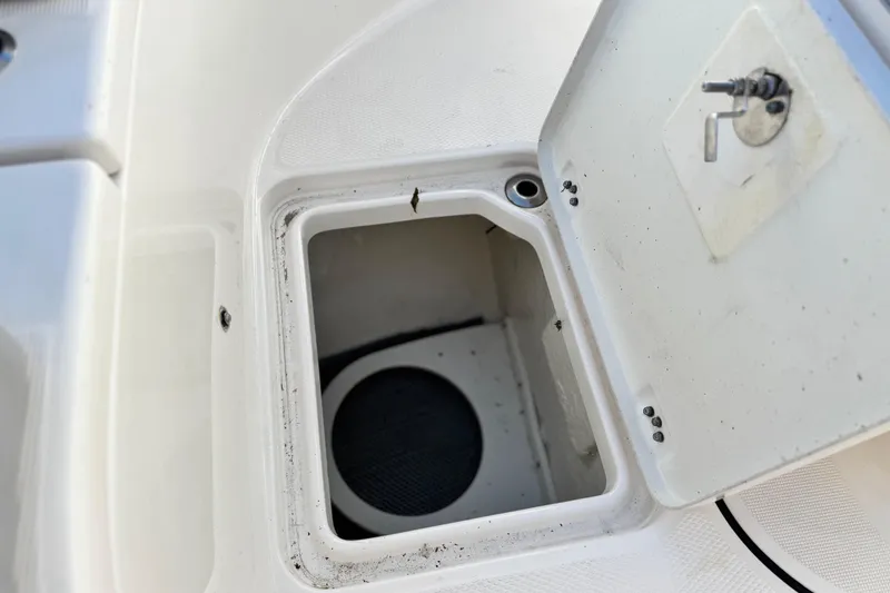 Slide: The Image of Open storage compartment on 2022 Robalo R222 Center Console boat. - 15
