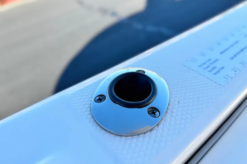 Slide: The Image of Close-up of a 2022 Robalo R222 Center Console boat's rod holder. - 20