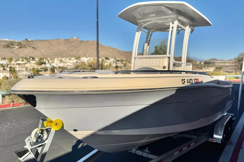 Slide: The Image of 2022 Robalo R222 Center Console boat on trailer, scenic mountain backdrop. - 3