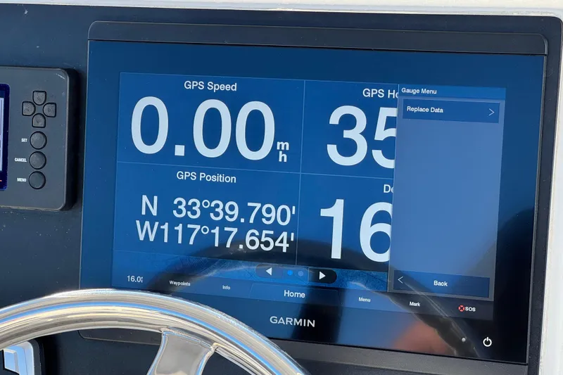 Slide: The Image of Garmin GPS display on 2022 Robalo R222 Center Console boat showing speed and coordinates. - 33