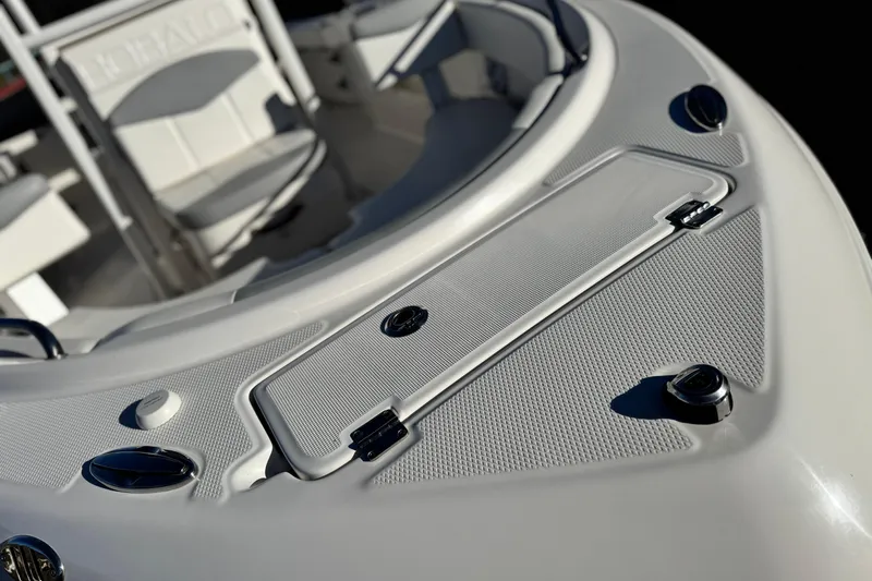 Slide: The Image of 2022 Robalo R222 Center Console boat interior with seating and storage compartments. - 9