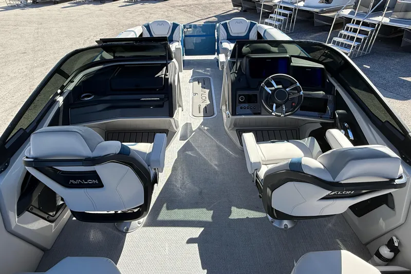 Slide: The Image of 2026 Avalon 2585 Excalibur boat interior with luxurious seating and modern dashboard. - 15