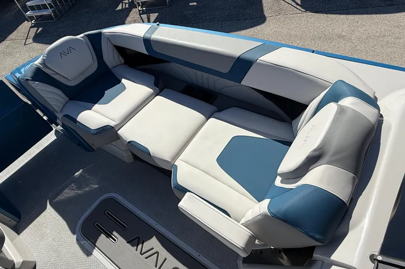 Slide: The Image of Luxurious seating on 2026 Avalon 2585 Excalibur Windshield Quad Lounger, featuring blue and white upholstery. - 18