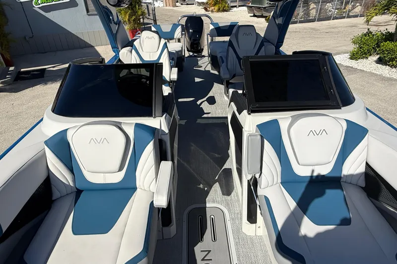 Slide: The Image of 2026 Avalon 2585 Excalibur boat interior with quad loungers and modern design. - 20