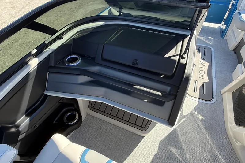 Slide: The Image of 2026 Avalon 2585 Excalibur boat interior with windshield and seating area. - 27