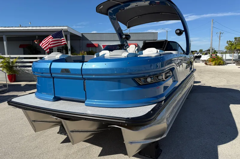 Slide: The Image of 2026 Avalon 2585 Excalibur Tri-toon boat with Mercury 400hp V-10 engine, blue exterior. - 3