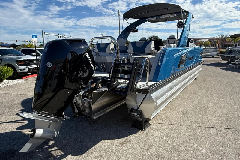 Slide: The Image of 2026 Avalon 2585 Excalibur Tri-toon boat with Mercury 400hp V-10 engine, blue exterior. - 8