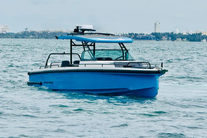 Slide: The Image of 2021 Axopar 37 Sun Top boat cruising on open water. - 1