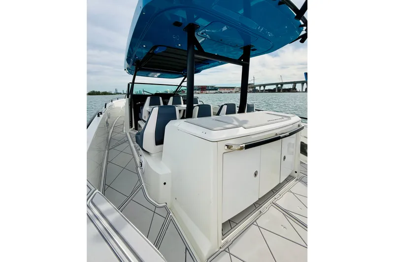 Slide: The Image of 2021 Axopar 37 Sun Top boat with sleek design and spacious deck on the water. - 43