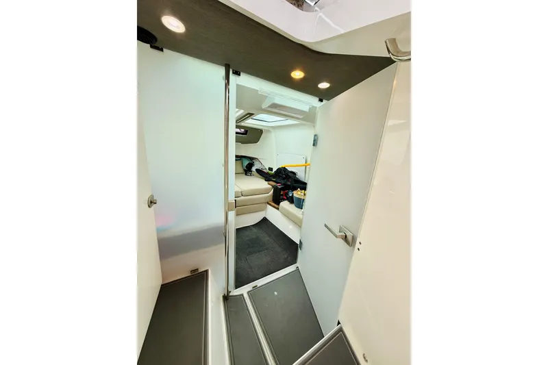 Slide: The Image of Interior view of 2021 Axopar 37 Sun Top cabin with seating and modern design. - 53
