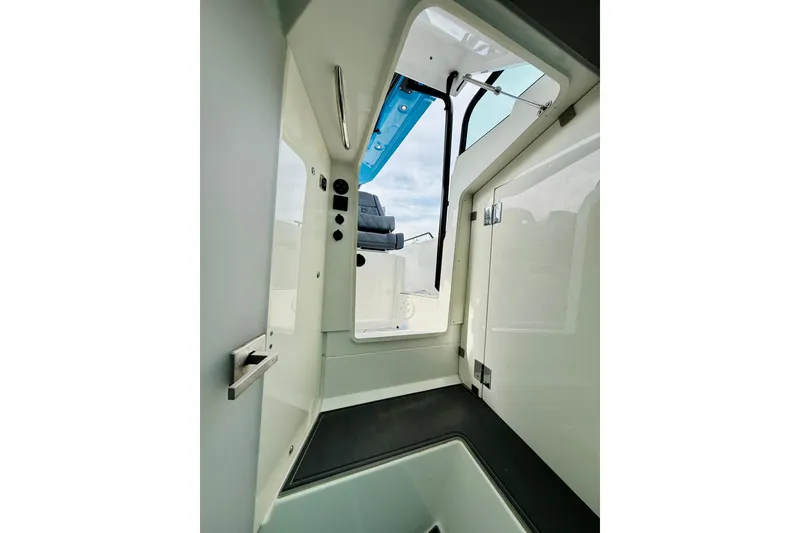 Slide: The Image of Interior view of 2021 Axopar 37 Sun Top boat, showcasing sleek design and modern features. - 57