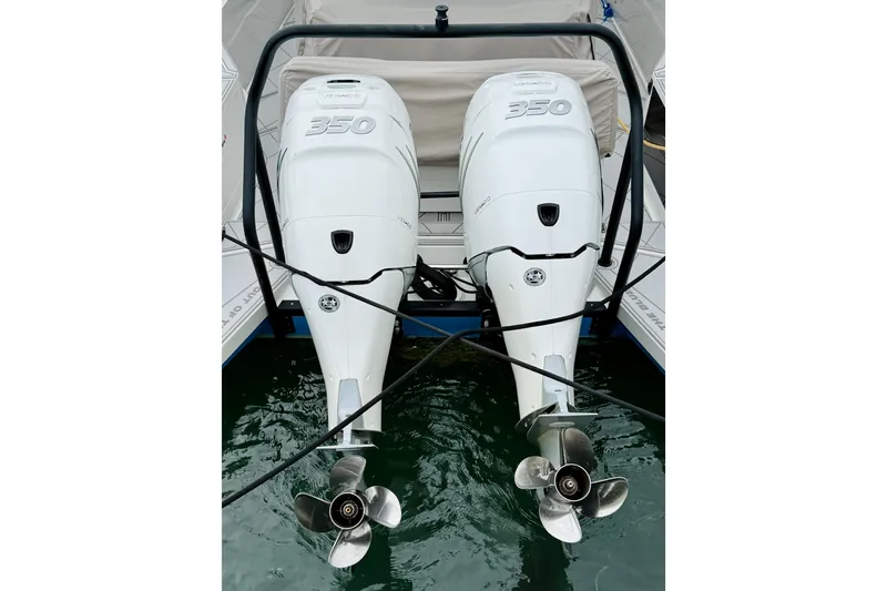 Slide: The Image of Twin 350 horsepower outboard engines on 2023 Axopar 37 Sun Top boat. - 66
