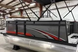 The Image of 2026 Qwest C-Class 14 Cruise pontoon boat in a showroom setting. - 0