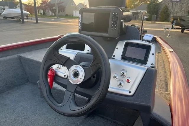 Slide: The Image of Steering console of 2025 Tracker Pro Team 175 boat with navigation equipment. - 11