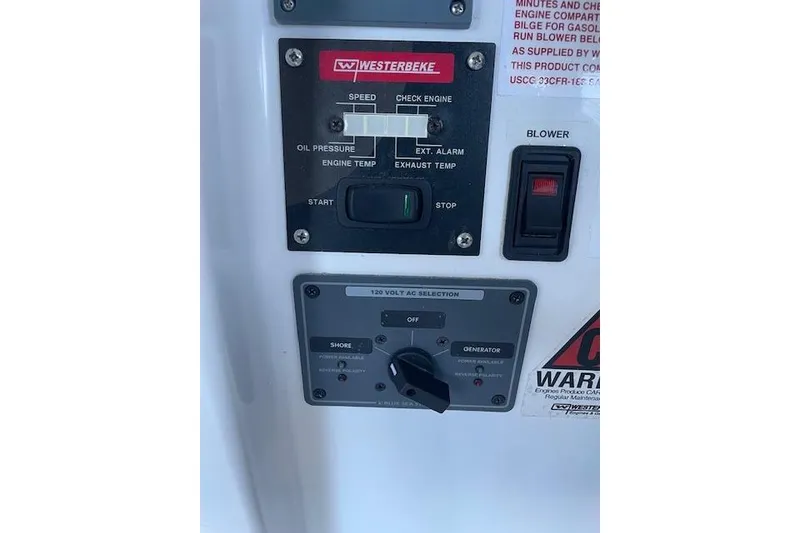 Slide: The Image of 2023 NorthCoast 315 boat control panel with Yamaha throttle and Garmin display. - 12