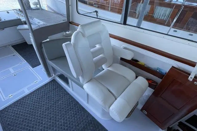 Slide: The Image of 2023 NorthCoast 315 cabin interior with bed, storage, and safety equipment. - 18