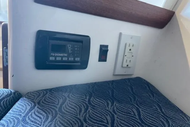 Slide: The Image of 2023 NorthCoast 315 boat interior with white captain's chair and modern design. - 24