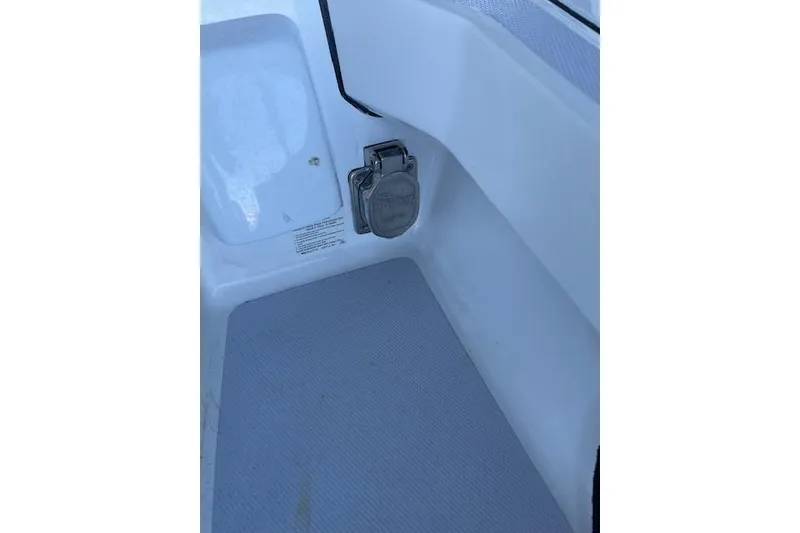 Slide: The Image of 2023 NorthCoast 315 boat docked in a marina under a covered area. - 3