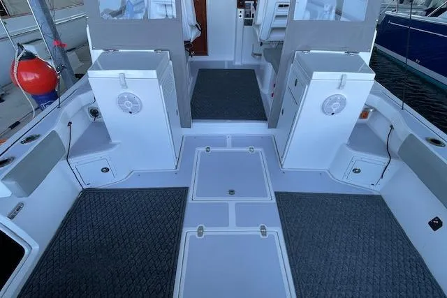 Slide: The Image of 2023 NorthCoast 315 boat interior with spacious deck and storage compartments. - 33