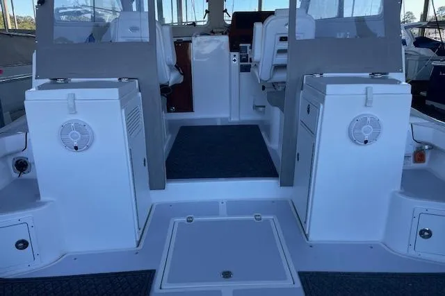 Slide: The Image of 2023 NorthCoast 315 boat interior with seating and storage compartments. - 35