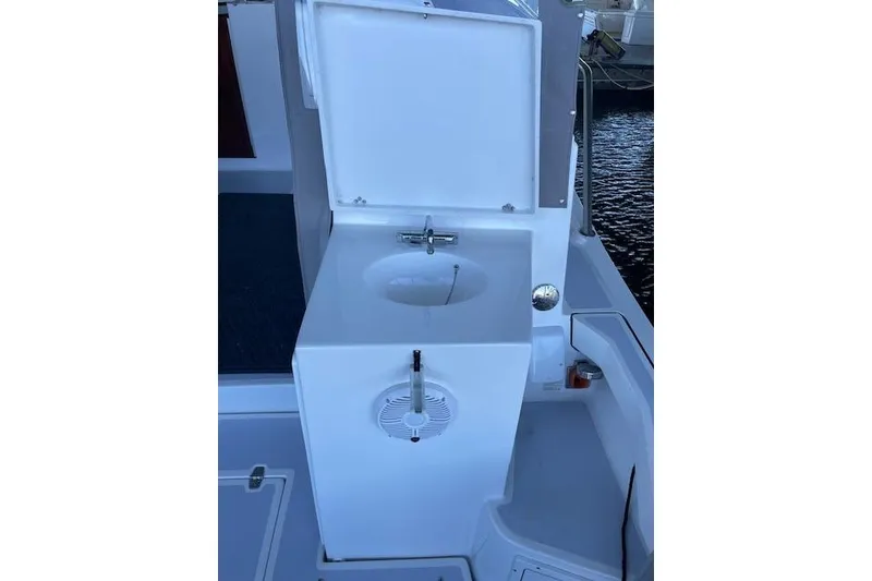 Slide: The Image of 2023 NorthCoast 315 boat sink with open lid, showcasing modern design. - 36