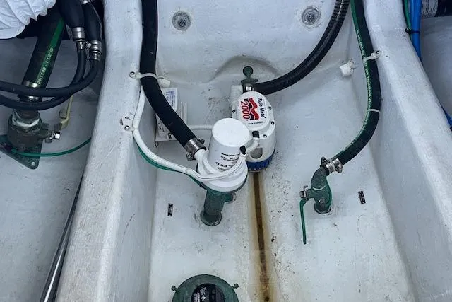 Slide: The Image of Bilge area of 2023 NorthCoast 315 boat with hoses and pump system. - 41