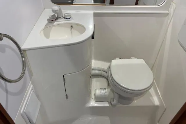 Slide: The Image of Compact bathroom in 2023 NorthCoast 315 boat with sink and toilet. - 42