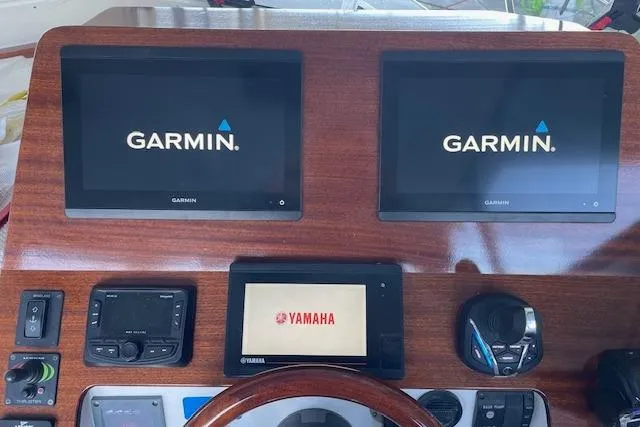 Slide: The Image of 2023 NorthCoast 315 boat interior with helm, seating, and navigation equipment. - 6