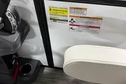 Slide: The Image of Interior of 2026 Qwest C-Class 18 Cruise boat with seating and control panel. - 6