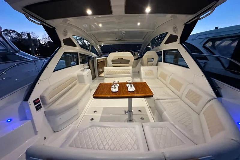 Slide: The Image of Luxurious interior of 2019 Beneteau Gran Turismo 40 yacht with elegant seating and table. - 12