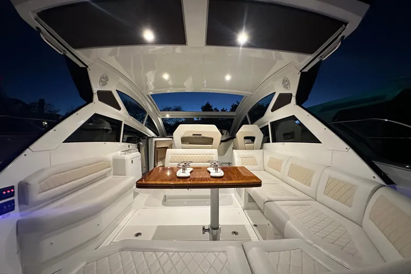 Slide: The Image of Luxurious interior of 2019 Beneteau Gran Turismo 40 yacht with elegant seating and table. - 13