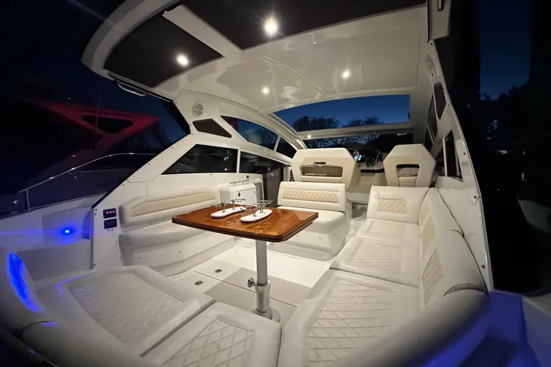 Slide: The Image of Luxurious 2019 Beneteau Gran Turismo 40 yacht interior with elegant seating and ambient lighting. - 14