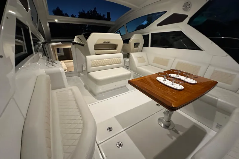 Slide: The Image of Luxurious interior of 2019 Beneteau Gran Turismo 40 yacht with elegant seating and dining area. - 15