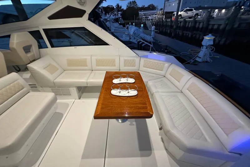 Slide: The Image of Luxurious seating area on a 2019 Beneteau Gran Turismo 40 yacht with elegant table setting. - 16