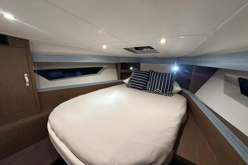 Slide: The Image of Luxurious cabin interior of 2019 Beneteau Gran Turismo 40 yacht with cozy bedding. - 31