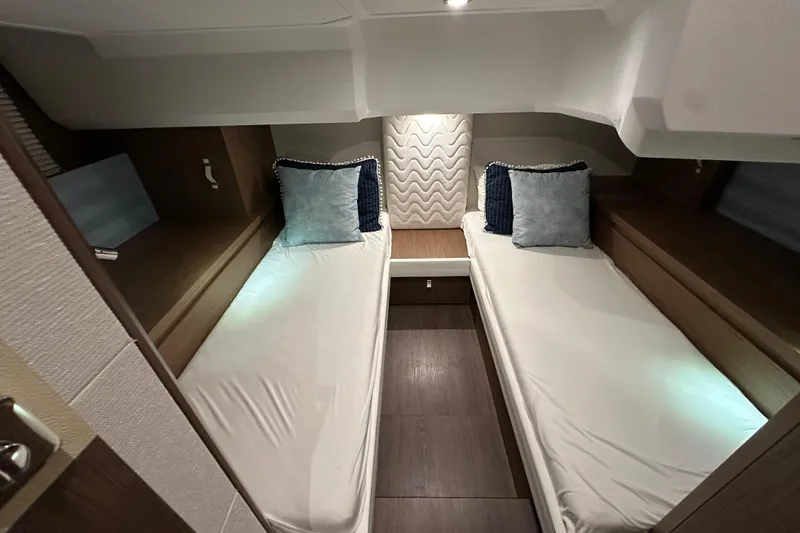 Slide: The Image of 2019 Beneteau Gran Turismo 40 cabin with twin beds and modern decor. - 34