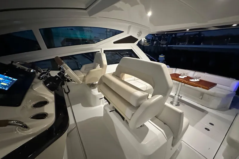 Slide: The Image of 2019 Beneteau Gran Turismo 40 yacht interior with helm, seating, and dining area. - 37