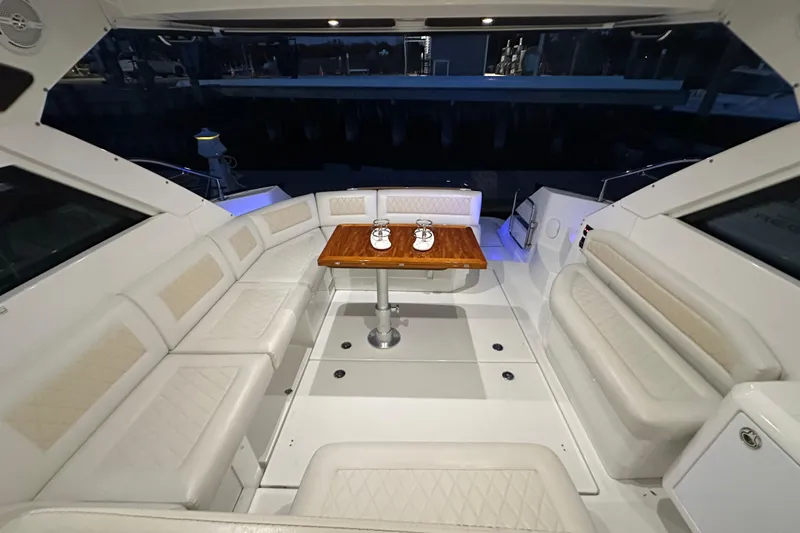 Slide: The Image of Luxurious interior of 2019 Beneteau Gran Turismo 40 yacht with elegant seating and table. - 38