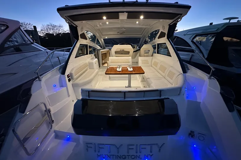Slide: The Image of 2019 Beneteau Gran Turismo 40 yacht interior with elegant seating and ambient lighting. - 9