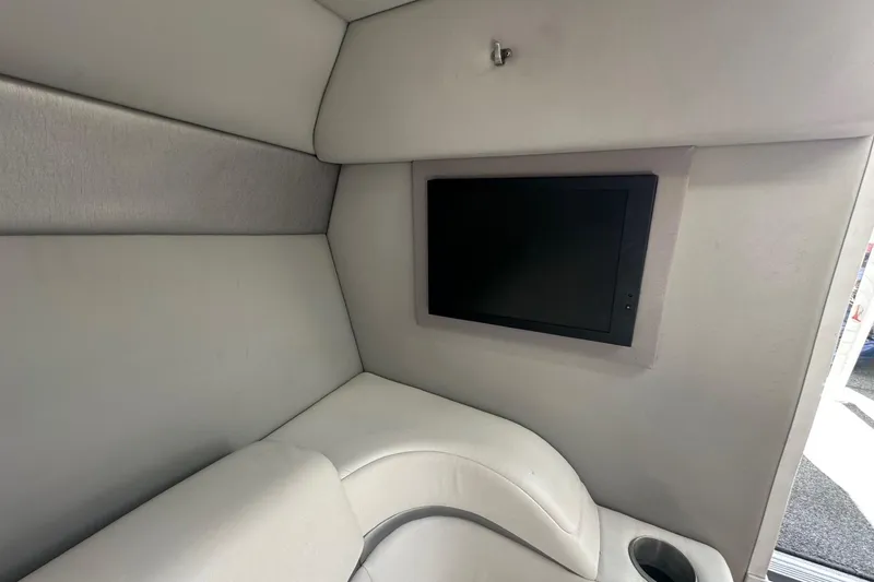 Slide: The Image of Interior of 2004 Formula 292 FASTech boat with cushioned seating and built-in screen. - 15
