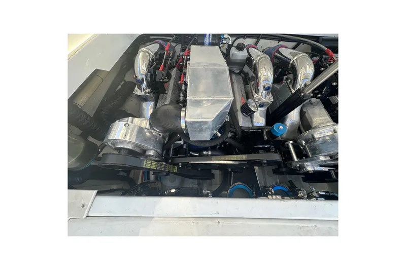 Slide: The Image of 2004 Formula 292 FASTech engine with chrome components and detailed mechanical parts. - 19