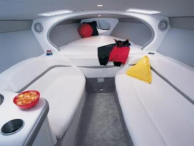 Slide: The Image of 2004 Formula 292 FASTech boat on trailer, towed by red truck at marina parking lot. - 4