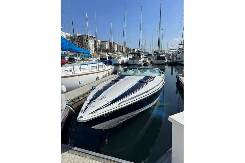 Slide: The Image of 2004 Formula 292 FASTech boat interior with white seating and dashboard controls. - 8
