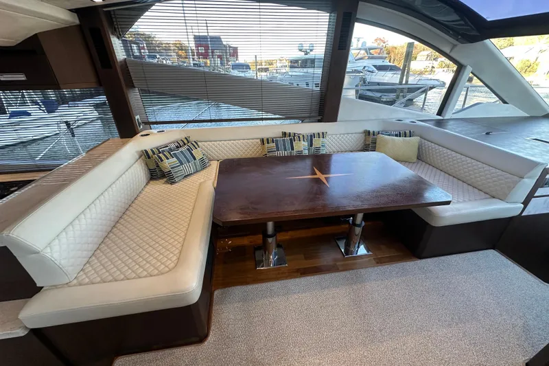 Slide: The Image of Luxurious interior of 2017 Galeon 560 Sky yacht with elegant seating and wooden table. - 10